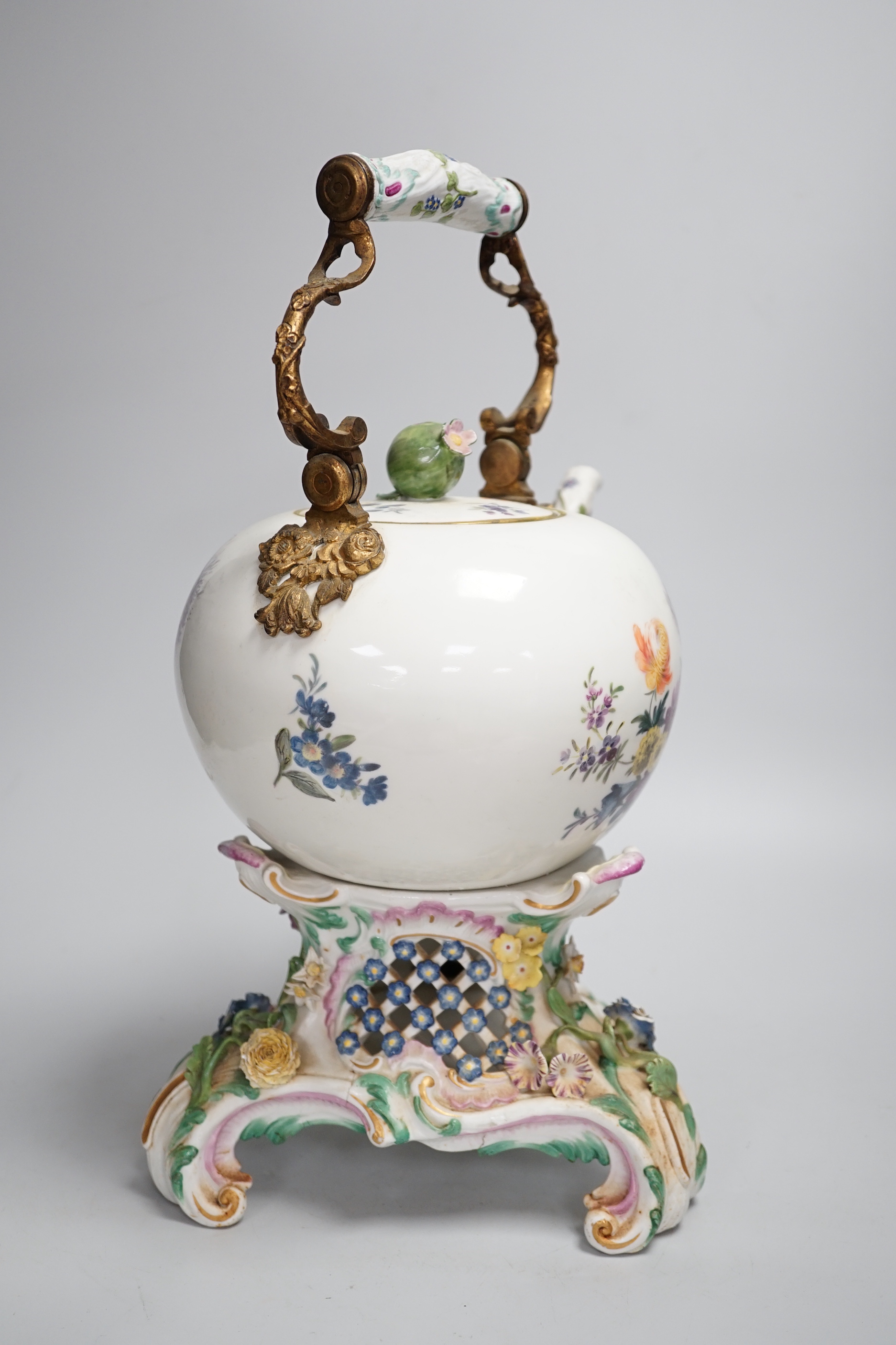 A mid 18th century Meissen teapot on a later Dresden stand with brass handle and floral decoration, height on stand 38cm